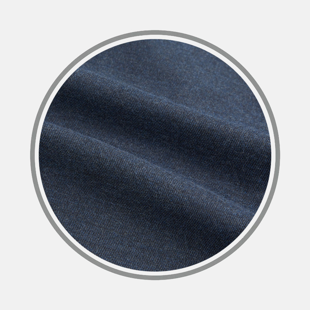 Close-up of Turnbull & Asser's Navy Flannel Fabric, highlighting its soft texture and visible diagonal weave, shown inside a circular frame against a light gray background.