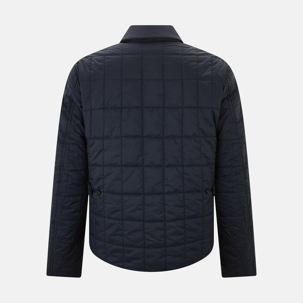 The Turnbull & Asser Battersea Navy Quilted Jacket features a versatile quilted design with a front zipper, zippered pockets, collared neckline, buttoned cuffs, and a subtle square pattern—perfect for the modern gentleman.