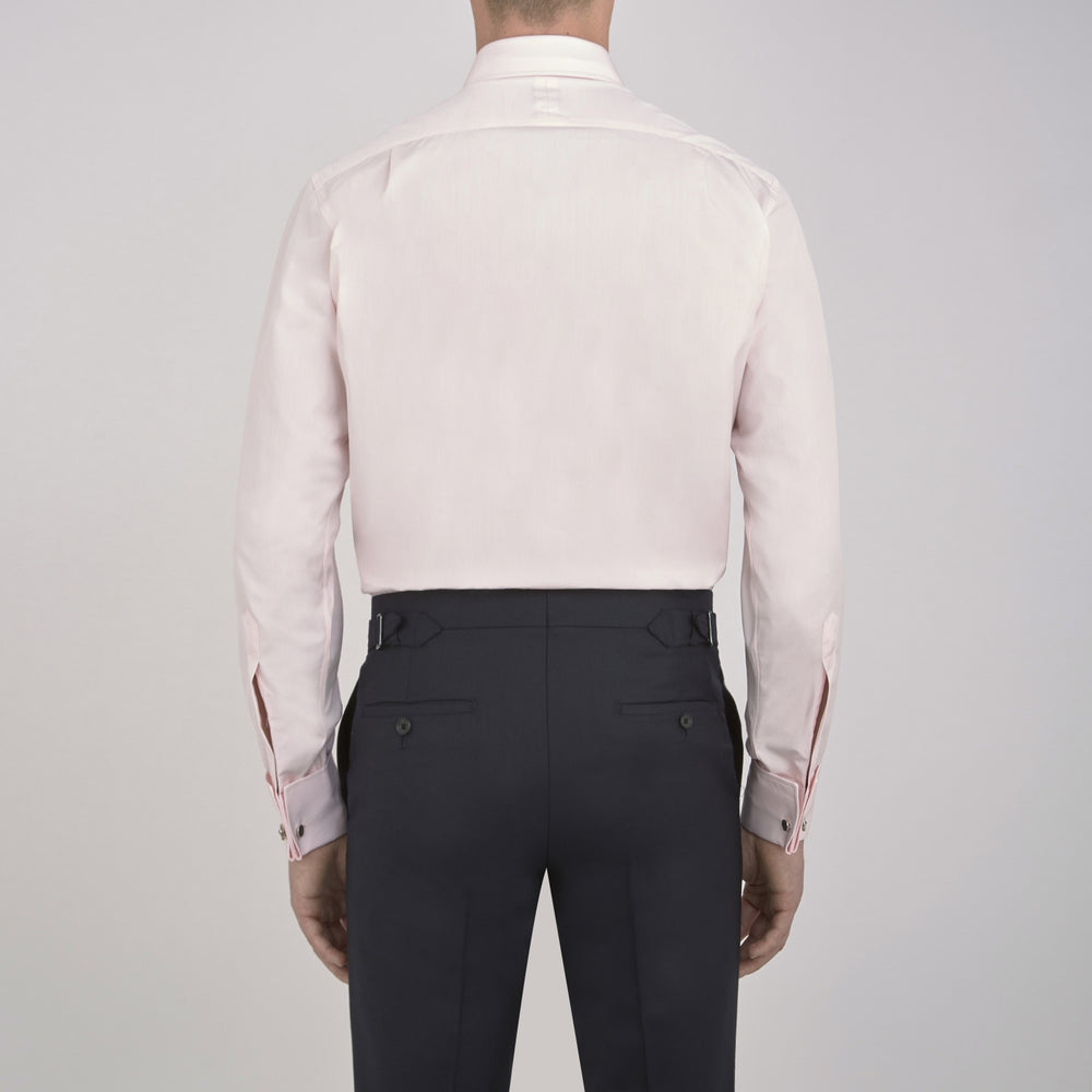 A Turnbull & Asser Pink Cotton Shirt with a T&A collar and double cuffs is displayed against a white background. The men's shirt features long sleeves, white buttons, and the label is visible inside the collar.