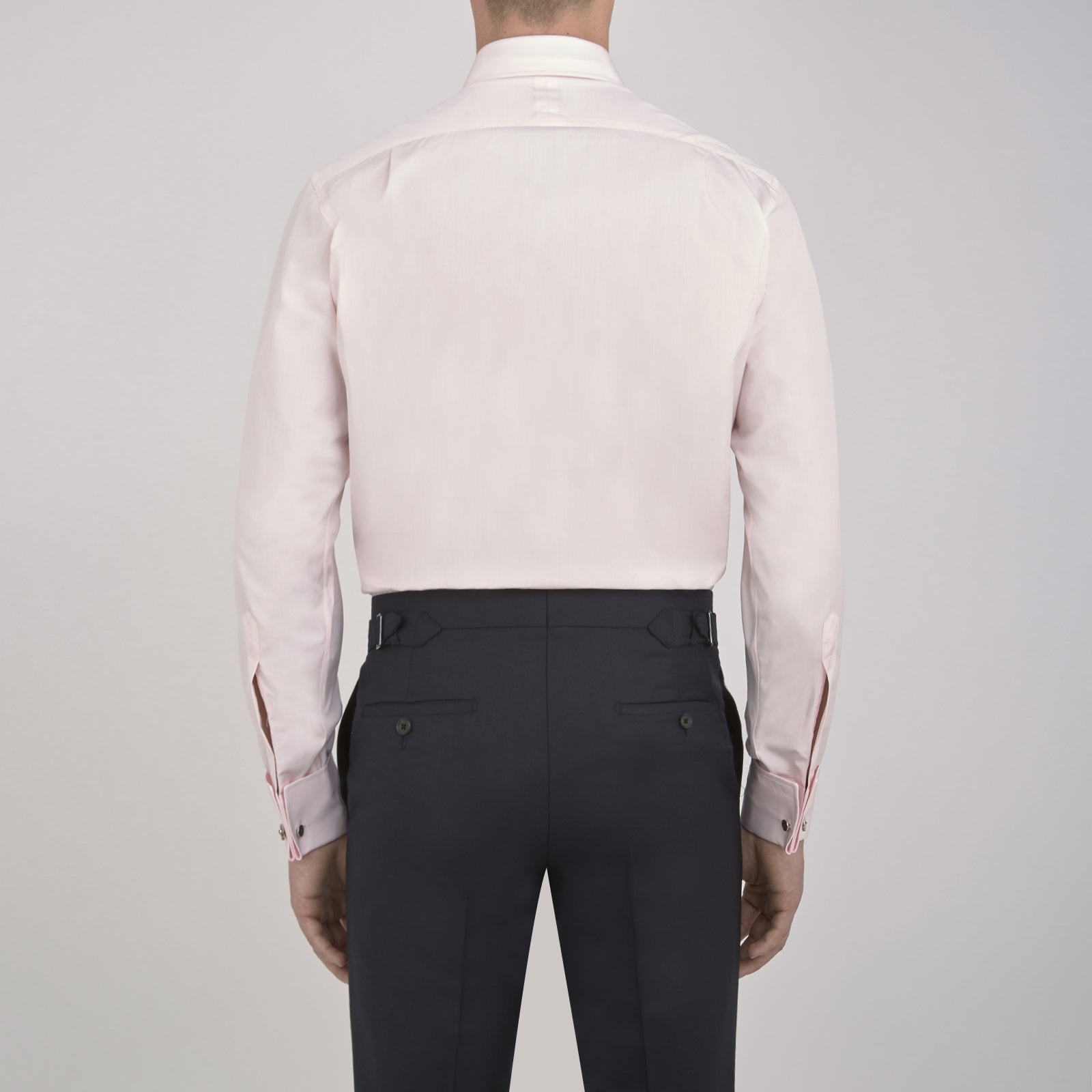 View 6 of product A Turnbull & Asser Pink Cotton Shirt with a T&A collar and double cuffs is displayed against a white background. The men's shirt features long sleeves, white buttons, and the label is visible inside the collar.