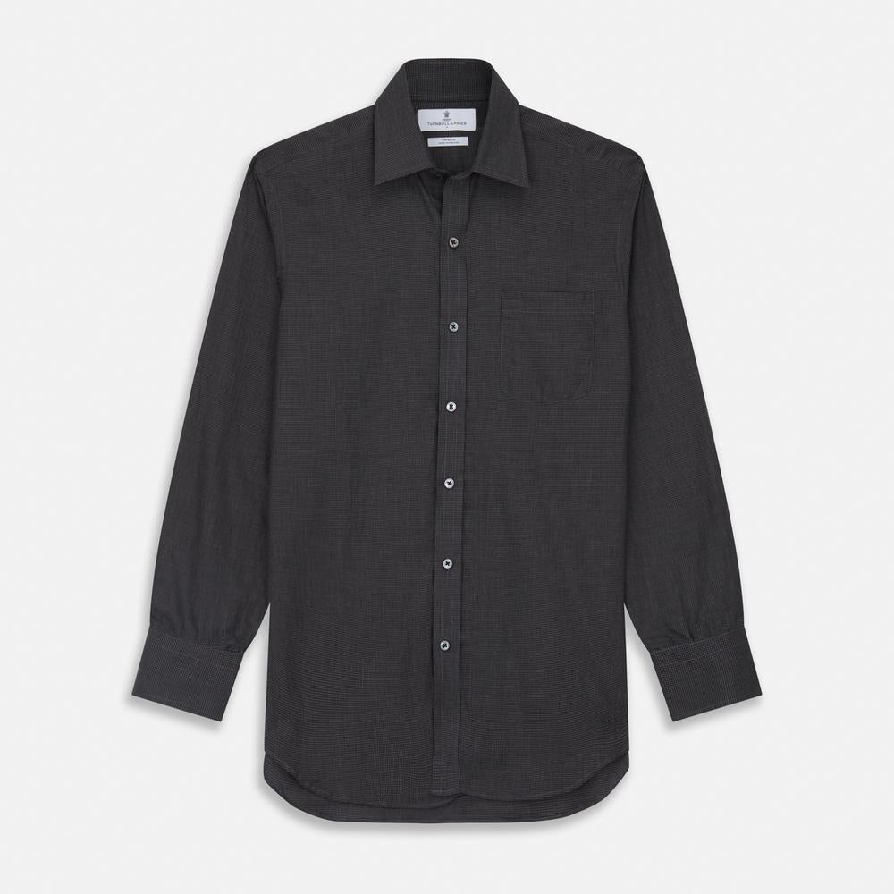 Close-up of Turnbull & Asser's Black Check Cotton Fabric, featuring a small black and gray houndstooth pattern, shown within a circular frame on a plain white background.