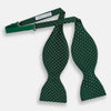View 2 of product The Turnbull & Asser Racing Green and White Spot Silk Bow Tie features small white polka dots on luxurious silk, shown against a plain white background.