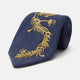 The Turnbull & Asser Navy Gold Embroidered Botanical Tie features intricate gold botanical embroidery on navy blue silk, neatly rolled with the detailed tip facing forward.
