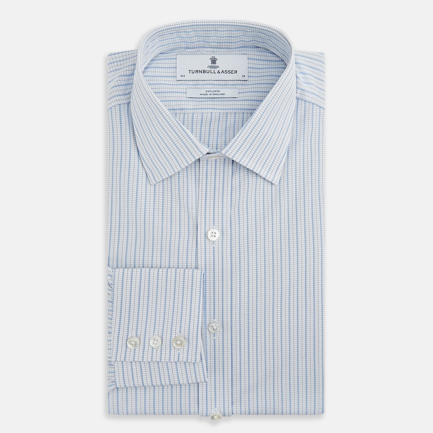 View 5 of product The Turnbull & Asser Blue Graph Check Mayfair Shirt features a classic T&A collar, Mayfair fit, buttoned cuffs, and long sleeves with light blue graph checks on a white background.