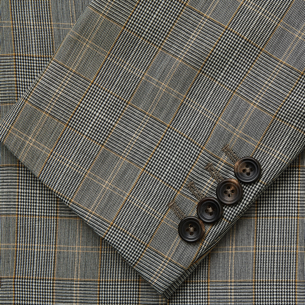 The Turnbull & Asser Beige Wool Prince-of-Wales Check Jacket is a single-breasted blazer with a notched lapel, one-button closure, two front flap pockets, and sleeve button details—an ideal lightweight summer jacket.