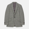 View 1 of product The Turnbull & Asser Beige Wool Prince-of-Wales Check Jacket is a single-breasted blazer with a notched lapel, one-button closure, two front flap pockets, and sleeve button details—an ideal lightweight summer jacket.