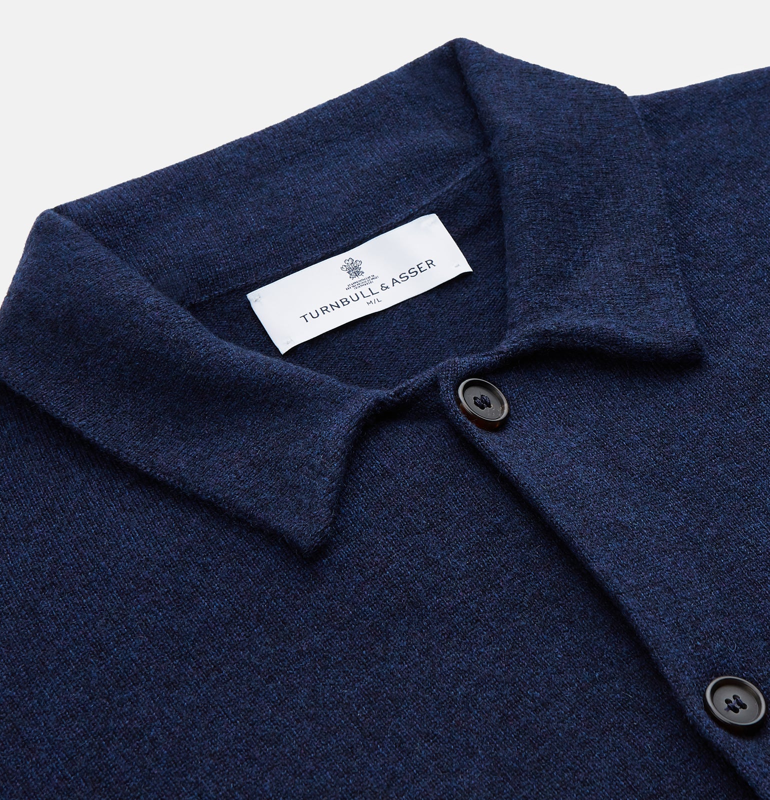 View 2 of product The Turnbull & Asser Navy Cashmere Knitted Traditional Pyjama Set features a long-sleeve camp collar shirt with front pockets and matching drawstring pants, offering an elevated twist on classic loungewear.
