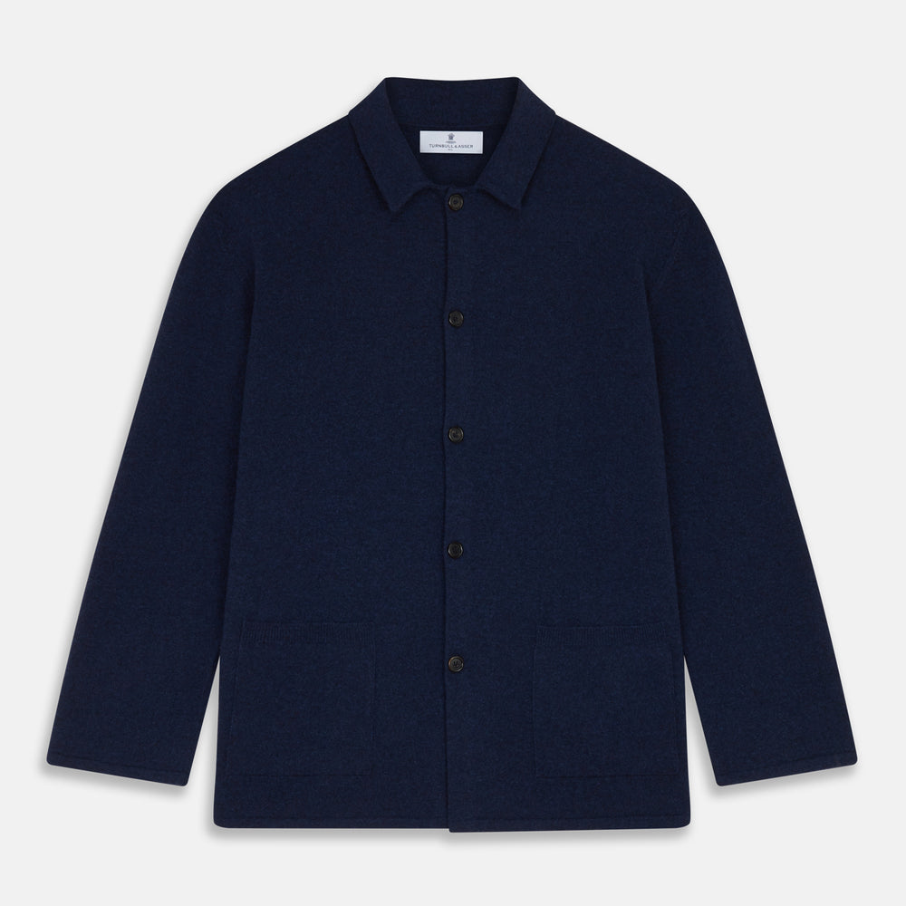 The Turnbull & Asser Navy Cashmere Knitted Traditional Pyjama Set features a long-sleeve camp collar shirt with front pockets and matching drawstring pants, offering an elevated twist on classic loungewear.