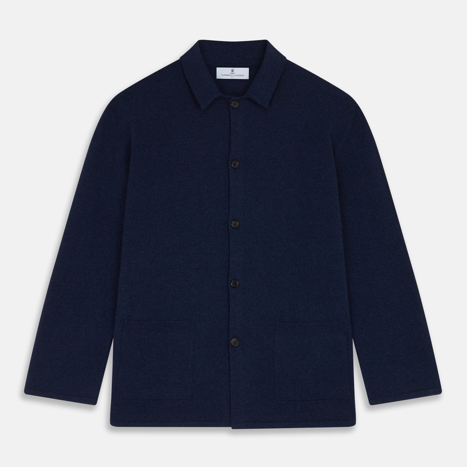 View 4 of product The Turnbull & Asser Navy Cashmere Knitted Traditional Pyjama Set features a long-sleeve camp collar shirt with front pockets and matching drawstring pants, offering an elevated twist on classic loungewear.