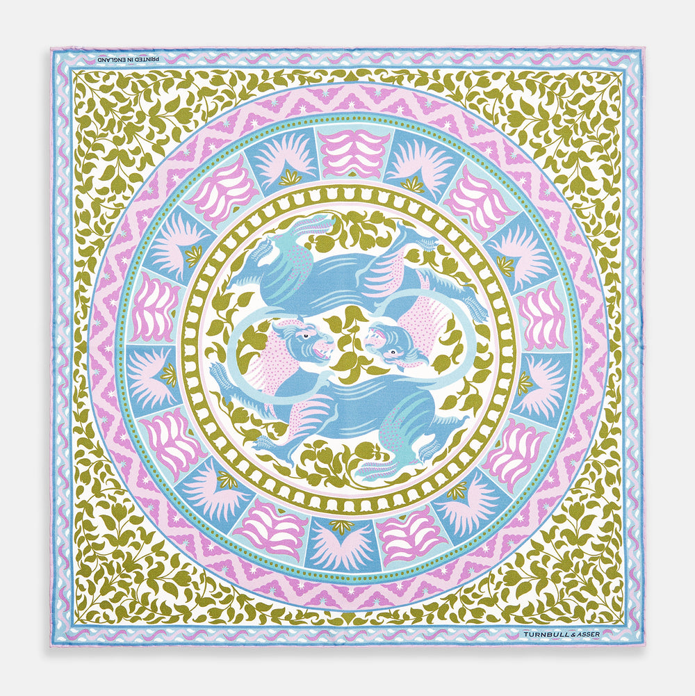 The Turnbull & Asser Green Multi Griffins Silk Pocket Square features blue mythical griffins at the center and decorative pink, gold, and blue borders—an ideal accessory for autumn ensembles.