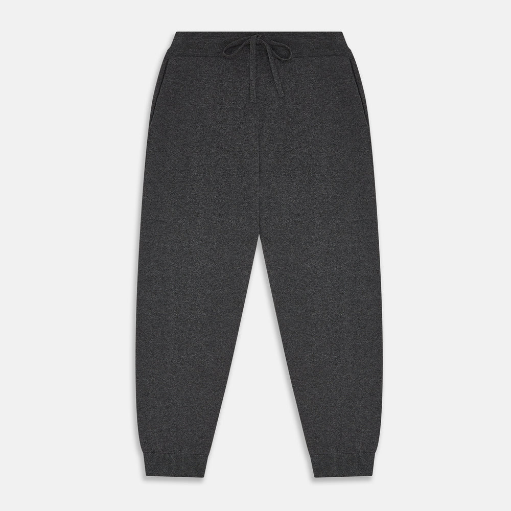 The Turnbull & Asser Grey Cashmere Knitted Lounge Pyjama Trousers feature an elastic waistband with drawstring, side pockets, and elastic cuffs at the ankles, shown laid flat on a white background.
