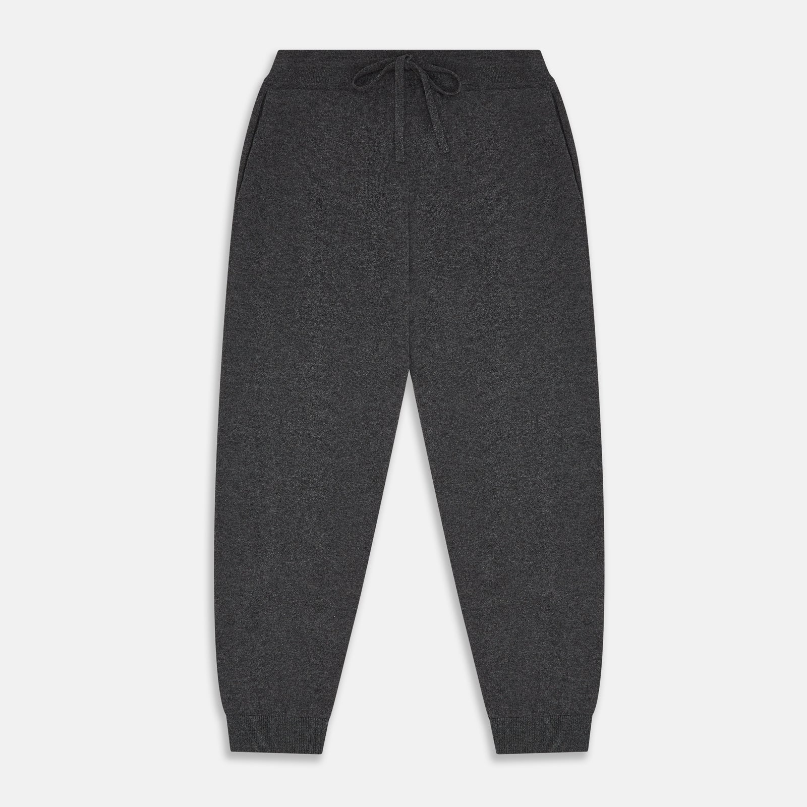 View 1 of product The Turnbull & Asser Grey Cashmere Knitted Lounge Pyjama Trousers feature an elastic waistband with drawstring, side pockets, and elastic cuffs at the ankles, shown laid flat on a white background.