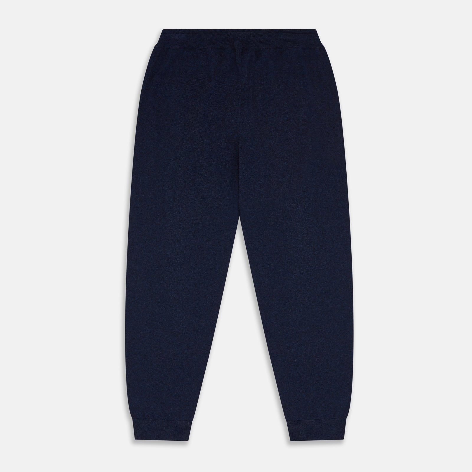 View 3 of product The Navy Cashmere Knitted Lounge Pyjama Trousers by Turnbull & Asser feature a contemporary fit, elastic waistband with drawstring, side pockets, and fitted cuffs, shown laid flat on a white background.