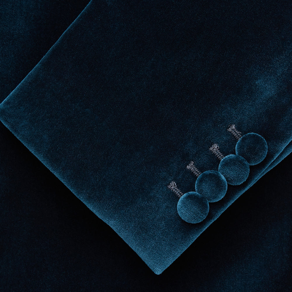 The Turnbull & Asser Teal Velvet Single Breasted Blazer features a single button closure, notched lapels, and front flap pockets, shown against a plain white background.