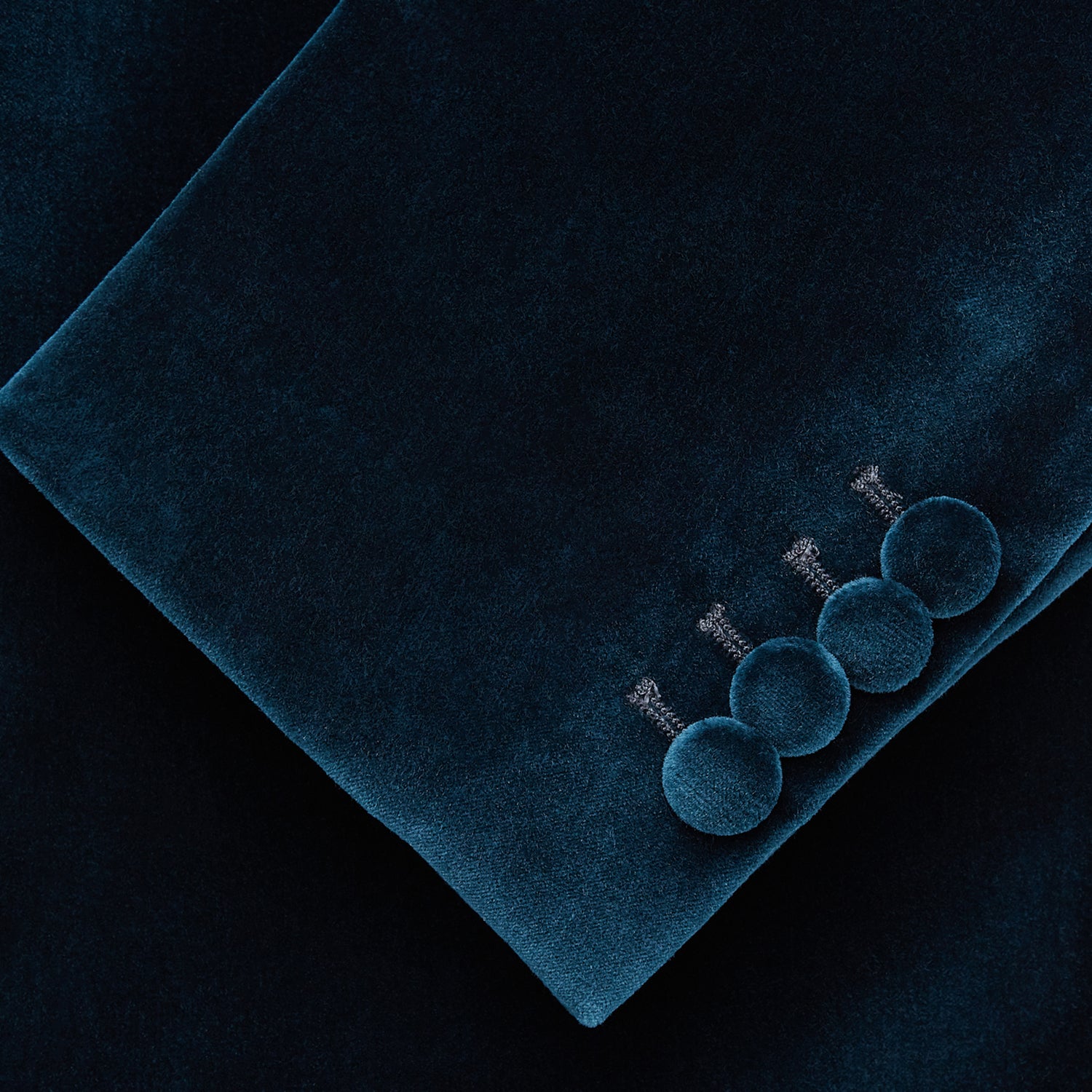 View 3 of product The Turnbull & Asser Teal Velvet Single Breasted Blazer features a single button closure, notched lapels, and front flap pockets, shown against a plain white background.