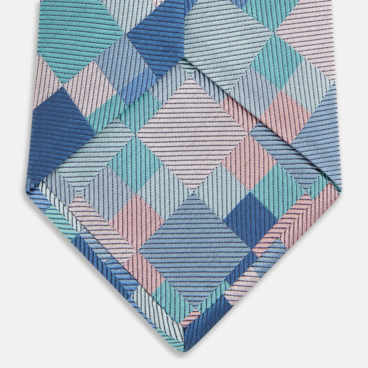 View 5 of product The Green Multi Pixel Silk Tie by Turnbull & Asser features a checked pattern in blue, teal, and pink on a light background, with diagonal stripes in each square for added texture.
