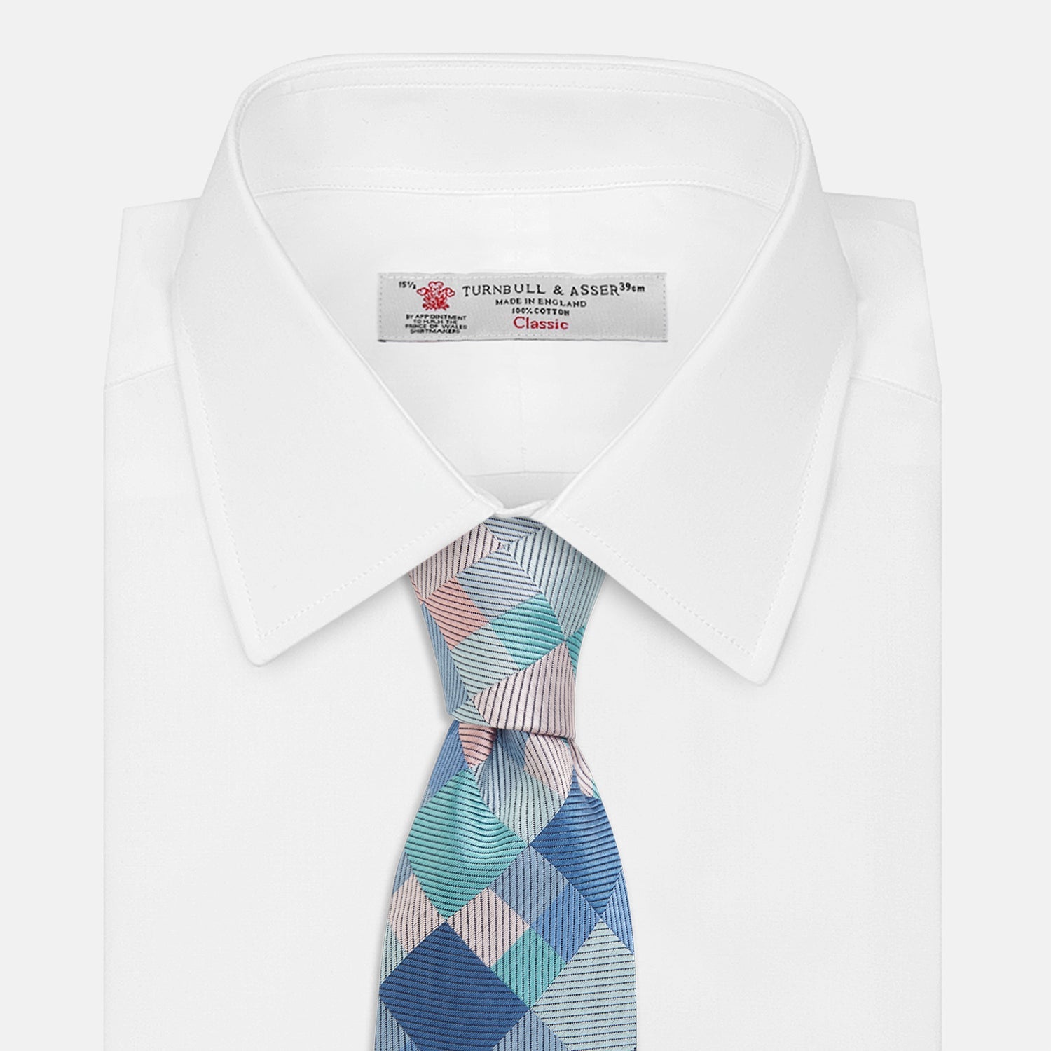 View 3 of product The Green Multi Pixel Silk Tie by Turnbull & Asser features a checked pattern in blue, teal, and pink on a light background, with diagonal stripes in each square for added texture.