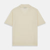 View 3 of product The Turnbull & Asser Ecru Merino Wool Roland Polo Shirt, made in Scotland, features soft merino wool, short sleeves, a relaxed open collar, and an inner neckline label. Shown here on a plain white background.