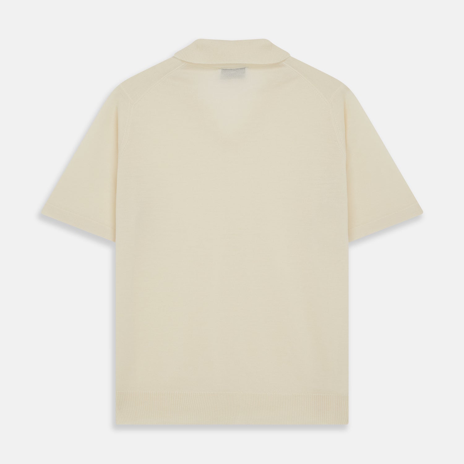 View 3 of product The Turnbull & Asser Ecru Merino Wool Roland Polo Shirt, made in Scotland, features soft merino wool, short sleeves, a relaxed open collar, and an inner neckline label. Shown here on a plain white background.