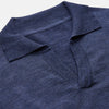 View 2 of product Turnbull & Asser Blue Merino Wool Roland Polo Shirt with short sleeves and an open collar, shown flat on a white background.