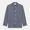 View 5 of product The Navy Motif Silk-Blend Hyde Pyjama Set by Turnbull & Asser features a blue and white pattern, long-sleeve button-up top with collar and front pocket, and matching pants, all displayed against a white background.
