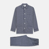 View 1 of product The Navy Motif Silk-Blend Hyde Pyjama Set by Turnbull & Asser features a blue and white pattern, long-sleeve button-up top with collar and front pocket, and matching pants, all displayed against a white background.