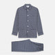 The Navy Motif Silk-Blend Hyde Pyjama Set by Turnbull & Asser features a blue and white pattern, long-sleeve button-up top with collar and front pocket, and matching pants, all displayed against a white background.