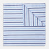 View 1 of product The Turnbull & Asser Blue Multi Stripe Cotton Handkerchief is shown flat against a white background, with one corner folded to reveal its reverse side. It features horizontal and vertical blue and white stripes on luxury cotton.