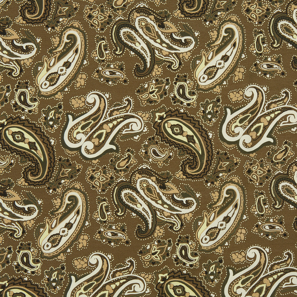 A green and lemon silk pocket square featuring a blossoming paisley pattern with a solid edge. “Turnbull & Asser” is inscribed in one corner; expertly crafted in England.