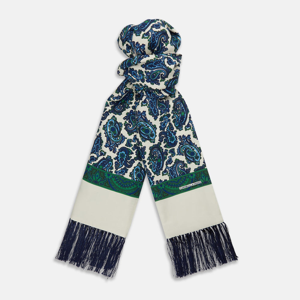 The Turnbull & Asser Green and Blue Paisley Silk Scarf features a blue and green paisley print on white, a solid cream section, a green stripe, and navy fringed ends.