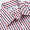View 3 of product The Turnbull & Asser Red and Blue Stripe Cotton Regular Fit Whitby Shirt is a long-sleeve button-up featuring vibrant red and blue stripes on white, with a collar and buttoned cuffs, shown on a plain white surface.