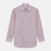View 1 of product The Turnbull & Asser Red and Blue Stripe Cotton Regular Fit Whitby Shirt is a long-sleeve button-up featuring vibrant red and blue stripes on white, with a collar and buttoned cuffs, shown on a plain white surface.