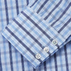 View 3 of product The Turnbull & Asser Light Blue and Navy Check Cotton Regular Fit Mayfair Shirt features a T&A collar and button-up long sleeves, displayed laid flat on a white background.
