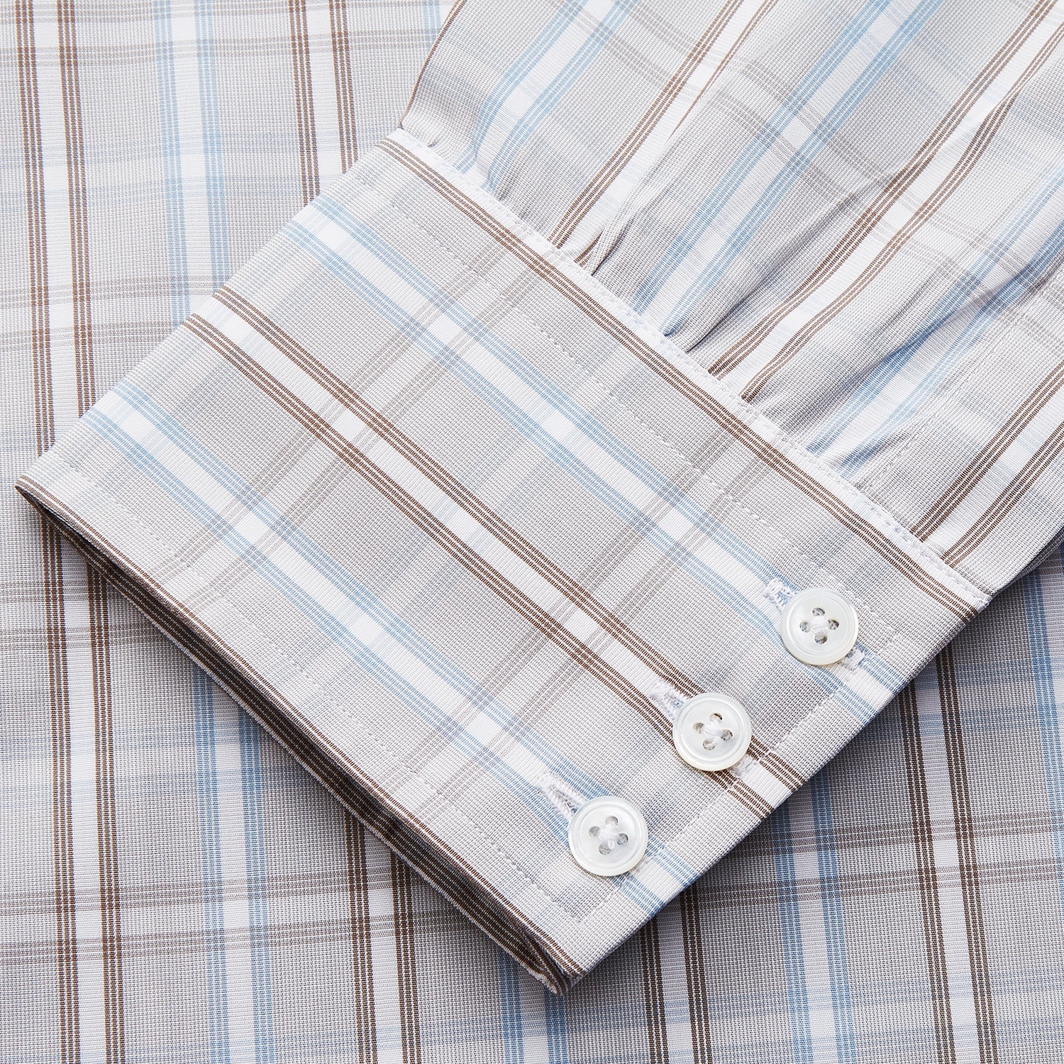 View 3 of product The Beige and Light Blue Check Cotton Regular Fit Mayfair Shirt by Turnbull & Asser features a classic plaid pattern, T&A collar, cuffed sleeves, and button-up front, shown laid flat on a white background.