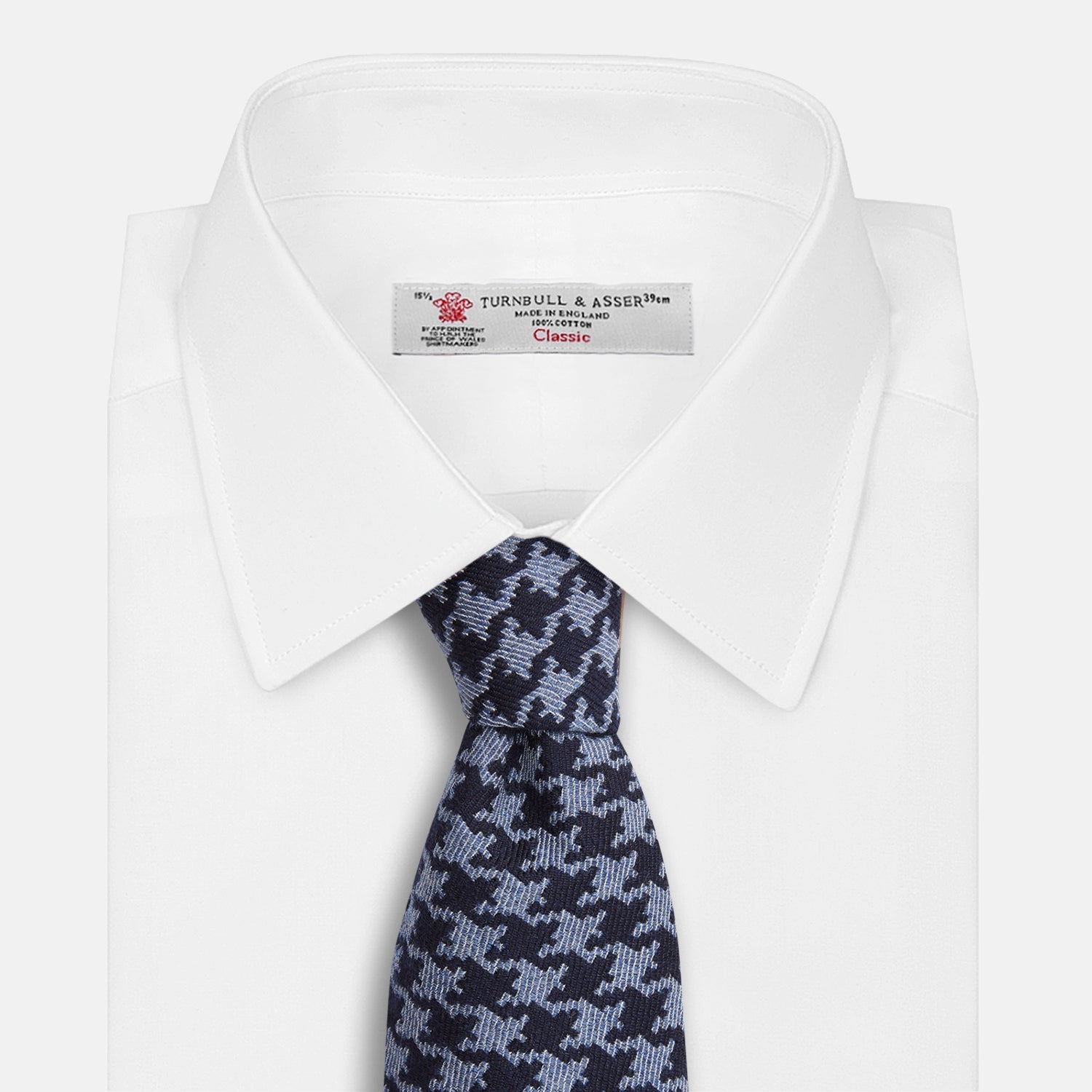 View 4 of product The Turnbull & Asser Navy and Blue Houndstooth Wool Blend Tie features a stylish houndstooth pattern in navy and light blue.