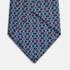View 3 of product A rolled-up Pale Blue and Purple Art Deco Silk Tie by Turnbull & Asser, handmade in England, is displayed on a plain white background.