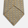 View 3 of product The Turnbull & Asser Yellow and Pale Blue Art Deco Silk Tie features interlocking yellow, blue, and black geometric shapes on white, adding a bold touch to any ensemble.
