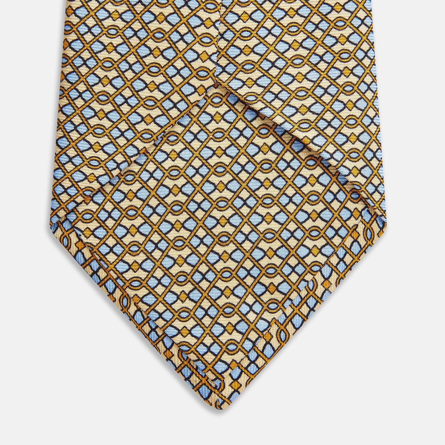 View 3 of product The Turnbull & Asser Yellow and Pale Blue Art Deco Silk Tie features interlocking yellow, blue, and black geometric shapes on white, adding a bold touch to any ensemble.