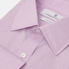 View 2 of product The Turnbull & Asser LILAC COTTON REGULAR FIT SHIRT is a long-sleeve, button-up cotton shirt with white buttons, a classic T&A collar, and cuffs, shown laid flat on a white background.