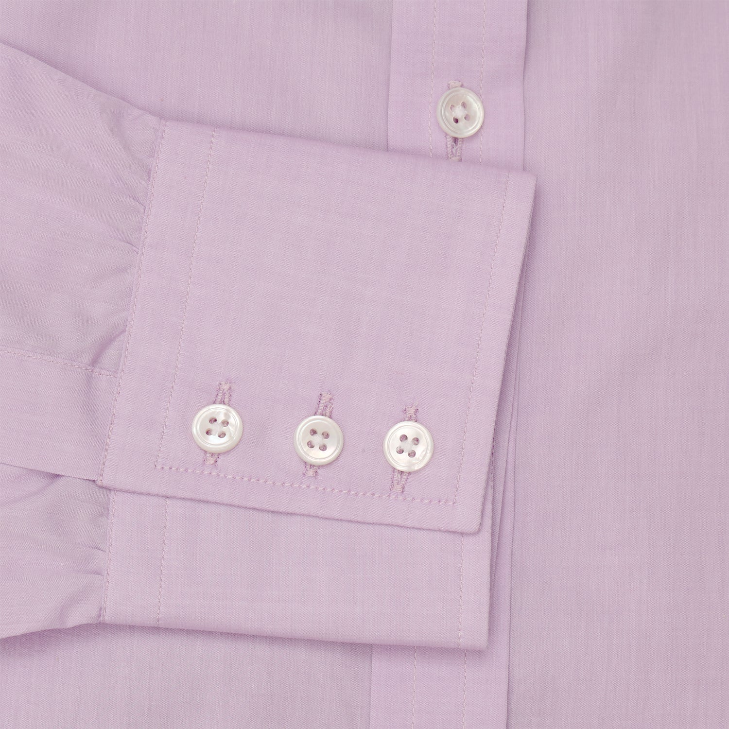 View 3 of product The Turnbull & Asser LILAC COTTON REGULAR FIT SHIRT is a long-sleeve, button-up cotton shirt with white buttons, a classic T&A collar, and cuffs, shown laid flat on a white background.