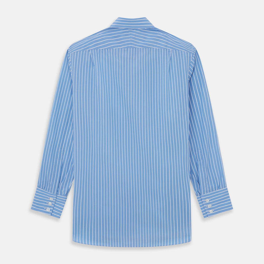 The Turnbull & Asser BLUE & WHITE STRIPE COTTON REGULAR FIT SHIRT features long sleeves, a pointed collar, and vertical white stripes on a light blue background, displayed against a plain white surface.
