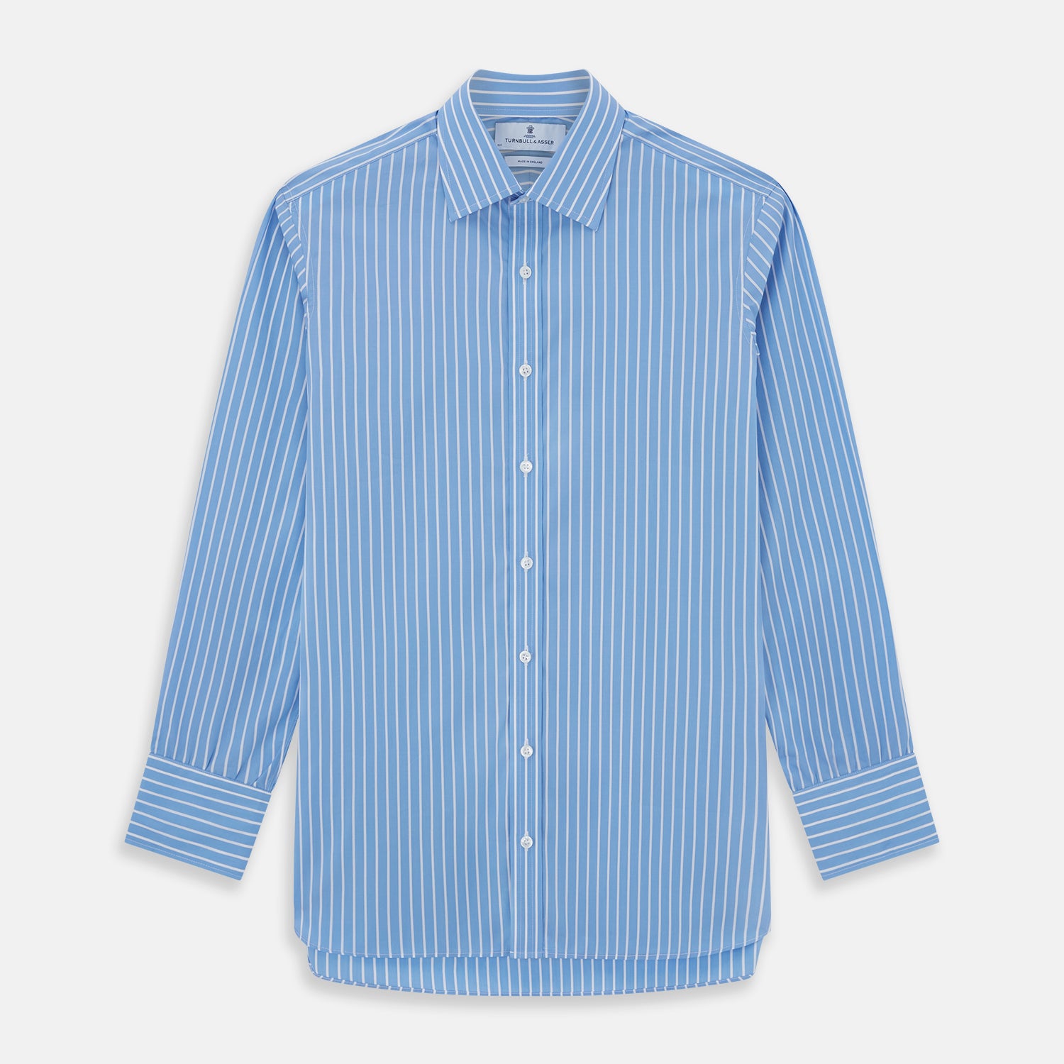 View 1 of product The Turnbull & Asser BLUE & WHITE STRIPE COTTON REGULAR FIT SHIRT features long sleeves, a pointed collar, and vertical white stripes on a light blue background, displayed against a plain white surface.