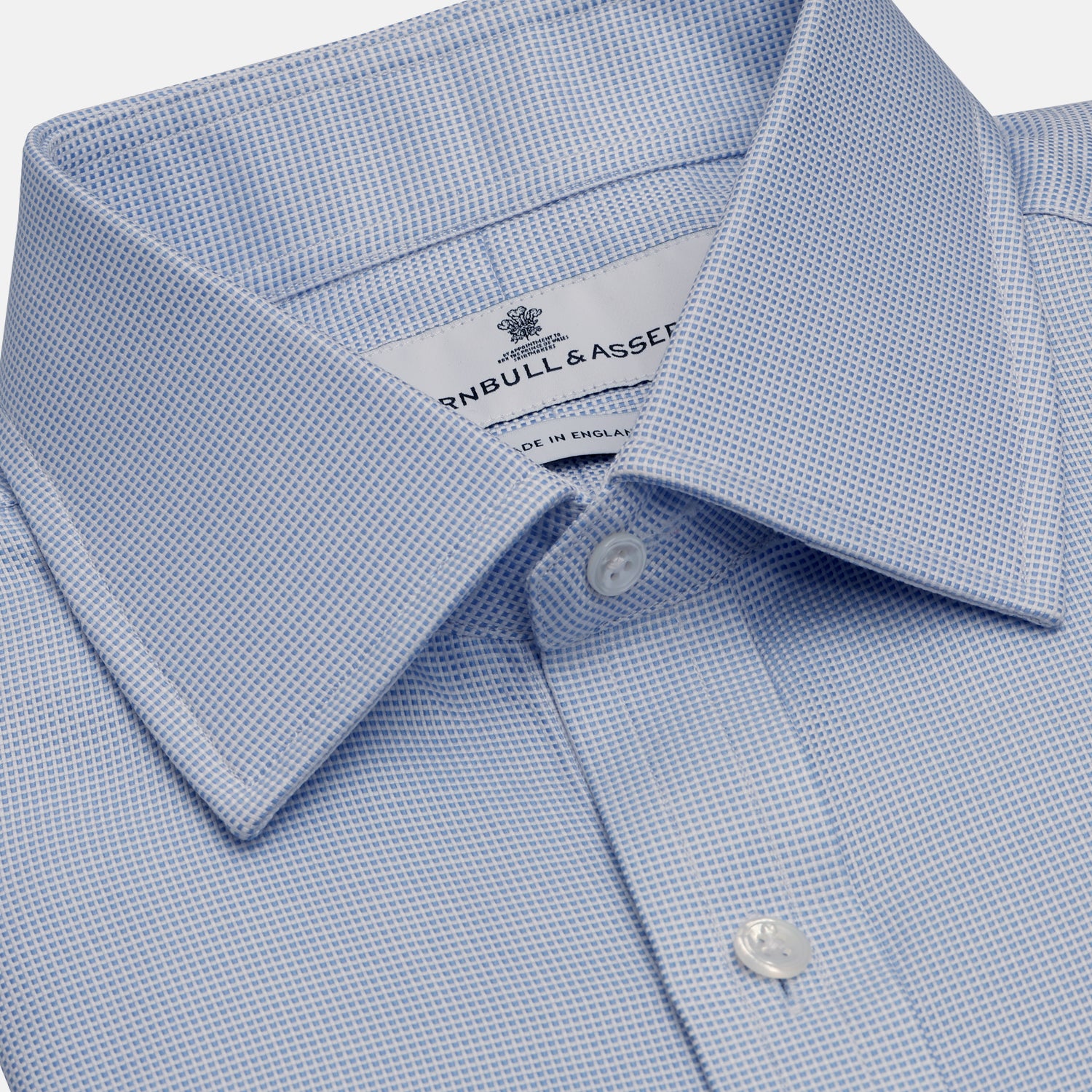 View 2 of product Turnbull & Asser's BLUE MULTI-CHECK COTTON REGULAR FIT SHIRT features a light blue check pattern, pointed collar, and white buttons—an essential classic for any men's wardrobe.
