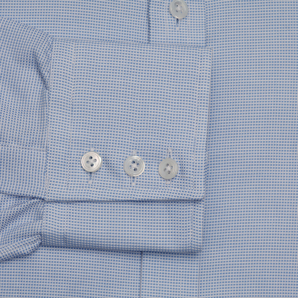 Turnbull & Asser's BLUE MULTI-CHECK COTTON REGULAR FIT SHIRT features a light blue check pattern, pointed collar, and white buttons—an essential classic for any men's wardrobe.