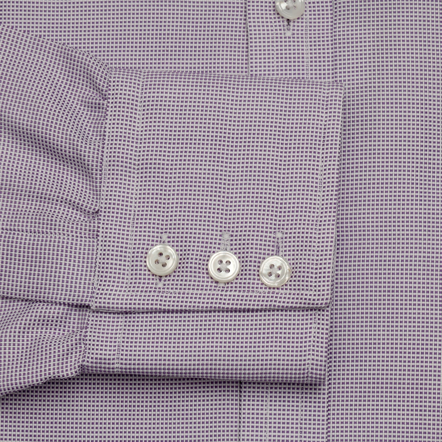 View 3 of product The Turnbull & Asser LILAC MULTI-CHECK COTTON REGULAR FIT SHIRT features long sleeves, a pointed collar, and white buttons—an essential men's wardrobe piece, shown laid flat on a white background.