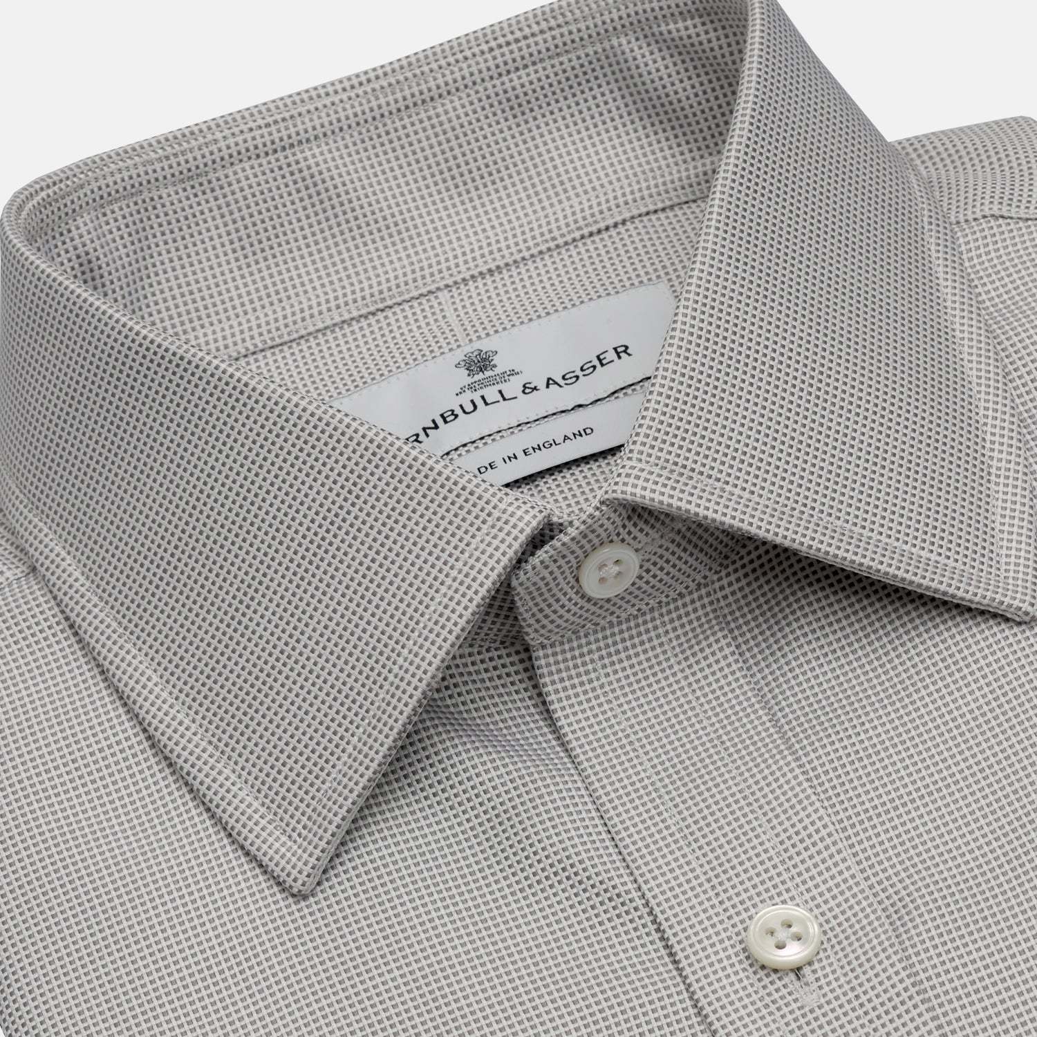 View 2 of product The Turnbull & Asser Silver Multi-Check Cotton Regular Fit Shirt features light gray cotton, a classic collar, buttoned cuffs, and a subtle silver check pattern—an essential for any men's wardrobe, shown flat on a white background.