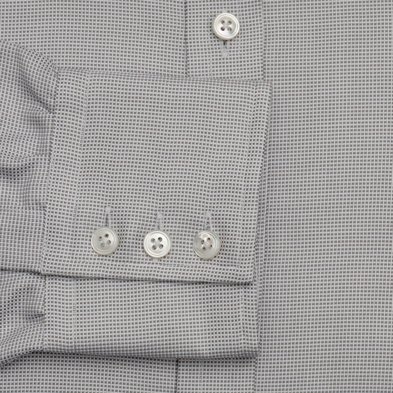 View 3 of product The Turnbull & Asser Silver Multi-Check Cotton Regular Fit Shirt features light gray cotton, a classic collar, buttoned cuffs, and a subtle silver check pattern—an essential for any men's wardrobe, shown flat on a white background.