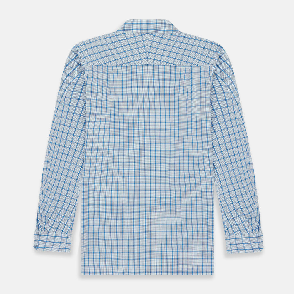 The Turnbull & Asser Blue Graph Overlay Check Piccadilly Shirt is a breathable cotton button-up featuring a collar, two chest pockets, white buttons, and an elegant blue graph check—perfect for the holidays.