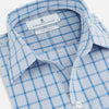 View 2 of product The Turnbull & Asser Blue Graph Overlay Check Piccadilly Shirt is a breathable cotton button-up featuring a collar, two chest pockets, white buttons, and an elegant blue graph check—perfect for the holidays.
