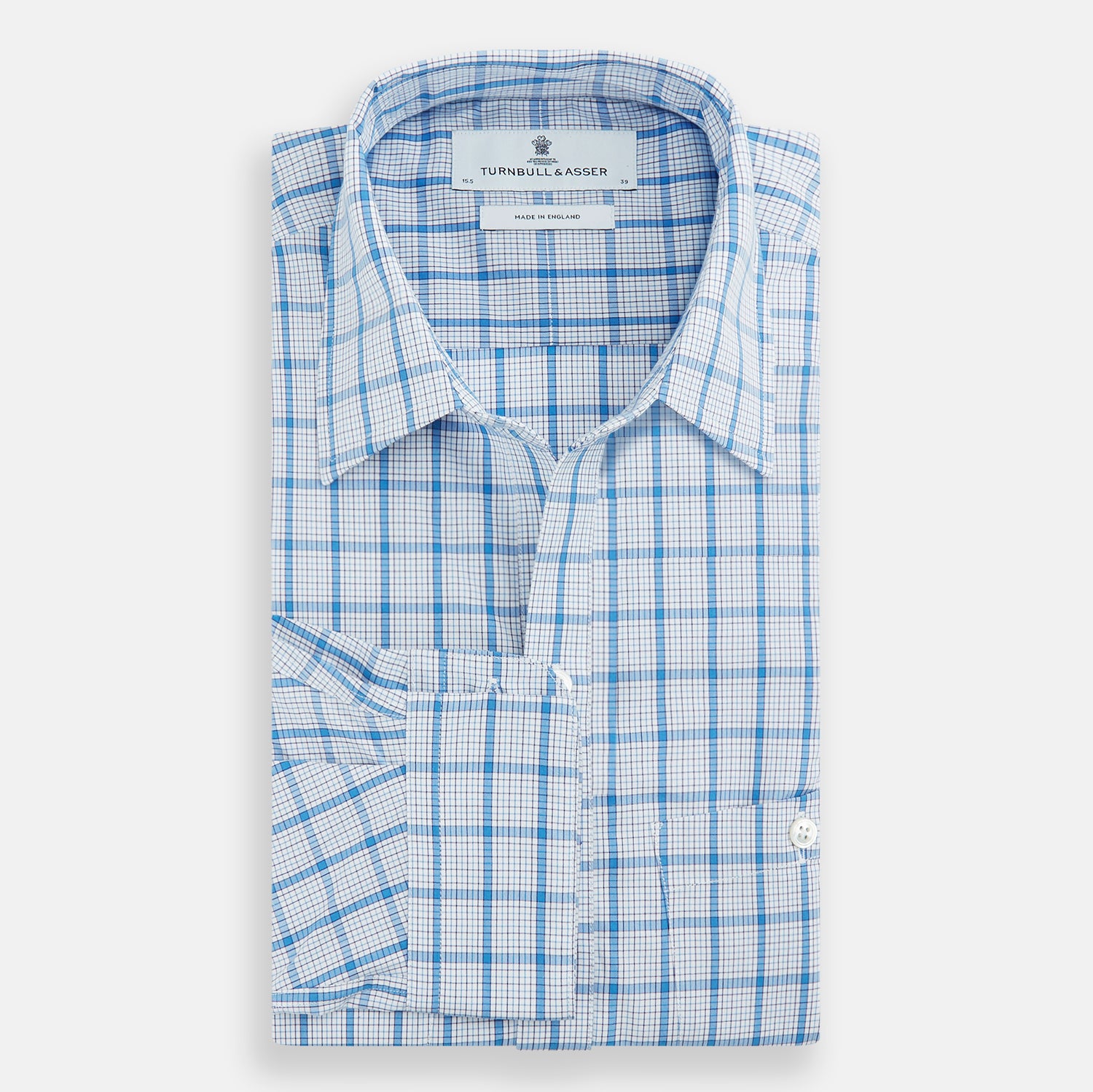 View 5 of product The Turnbull & Asser Blue Graph Overlay Check Piccadilly Shirt is a breathable cotton button-up featuring a collar, two chest pockets, white buttons, and an elegant blue graph check—perfect for the holidays.